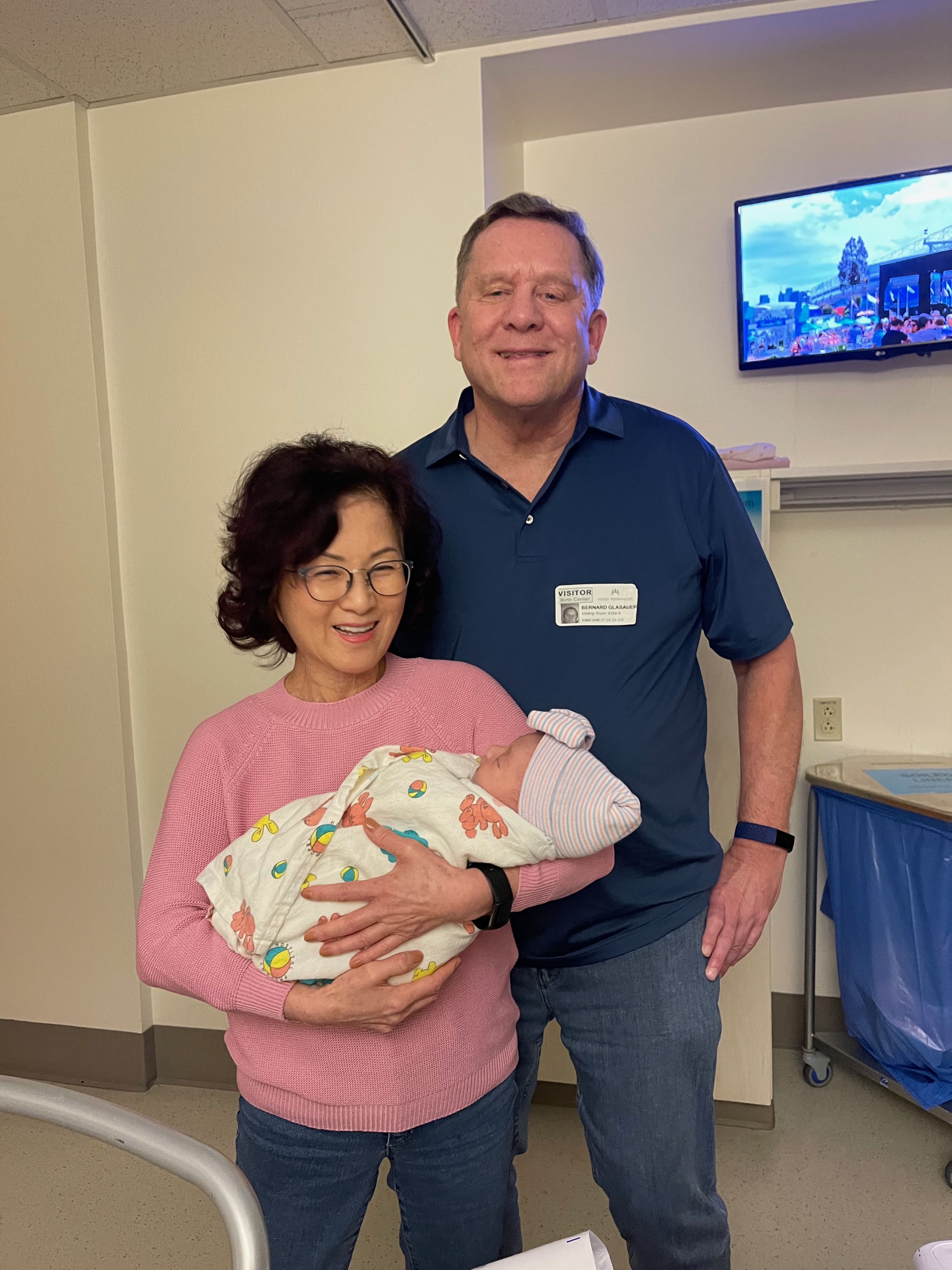 Mom happily retired, holding her first granddaughter