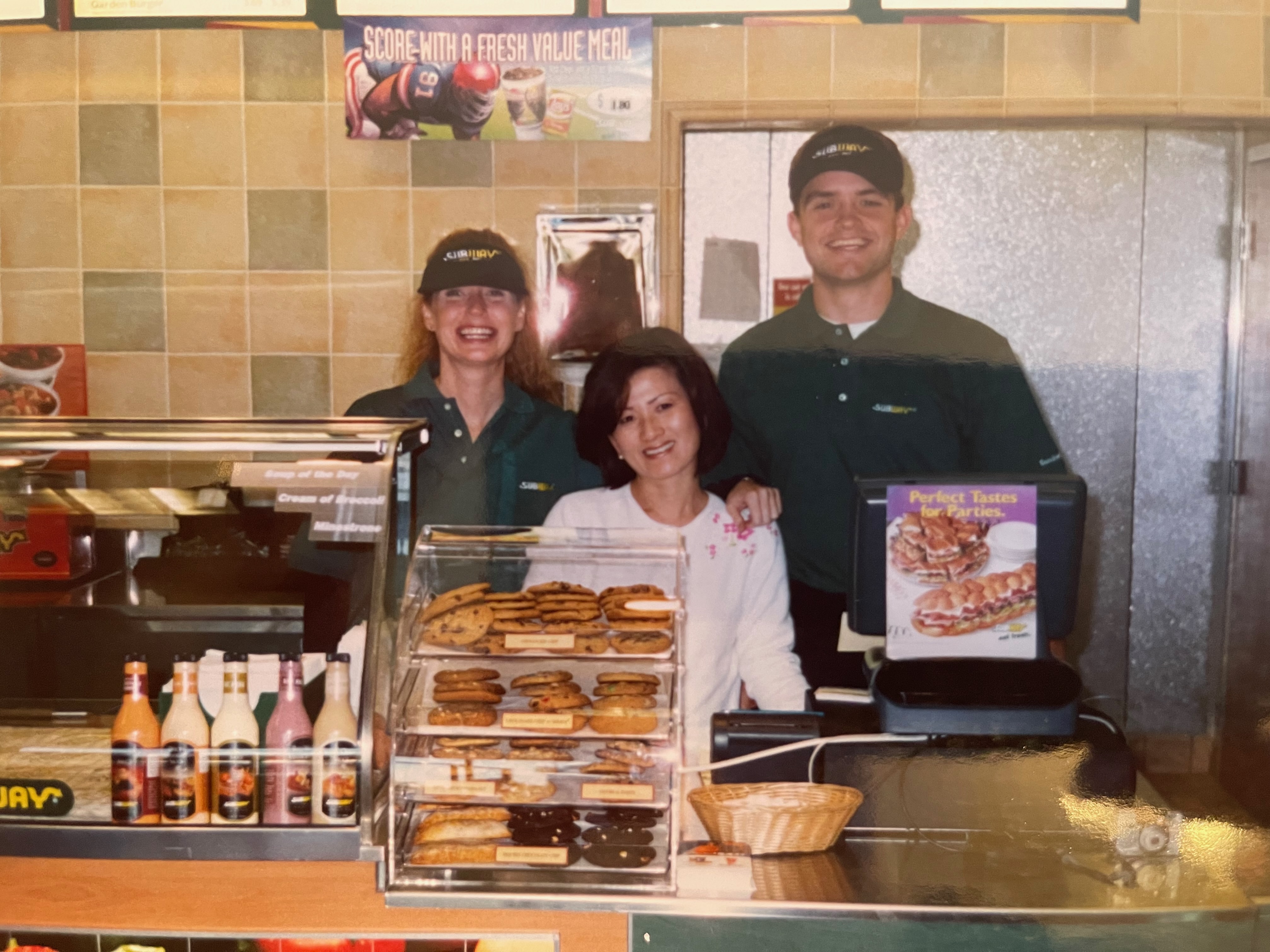 Mom working the cash register at her first Subway opening day